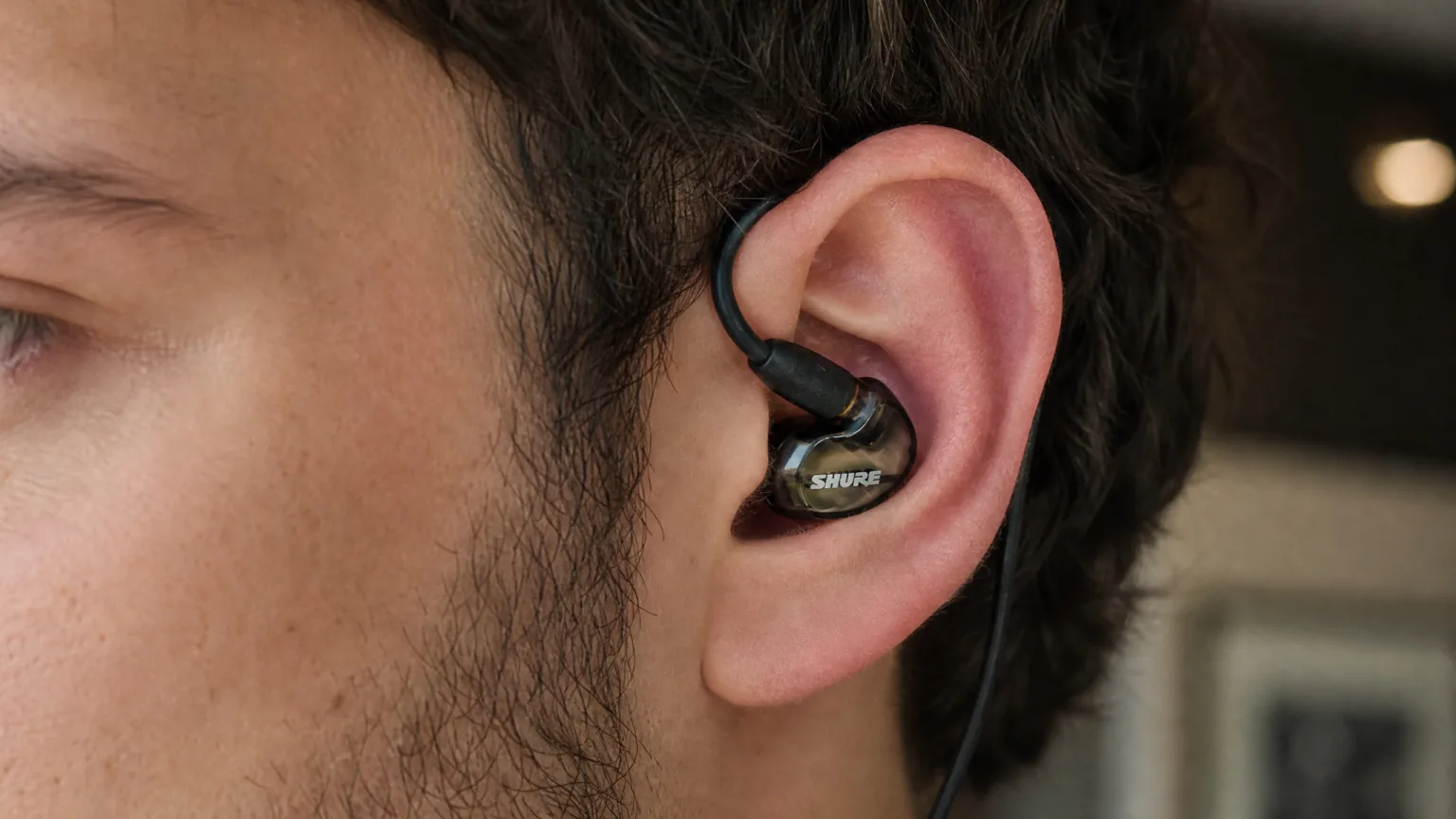 Shure SE535 in-ear monitor worn in an ear