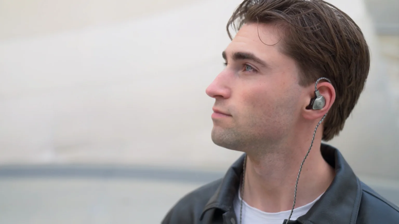 Man wearing Soundbrenner Wave Pro 2 in-ear monitors